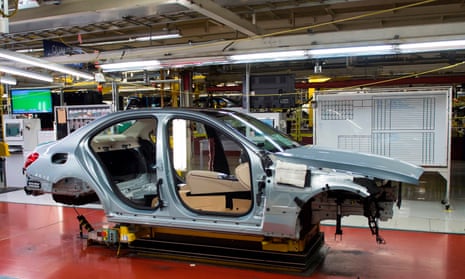 A Mercedes-Benz C-Class frame moves down the production line at a factory in Alabama.