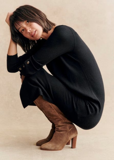 Model wearing a black knitted dress.