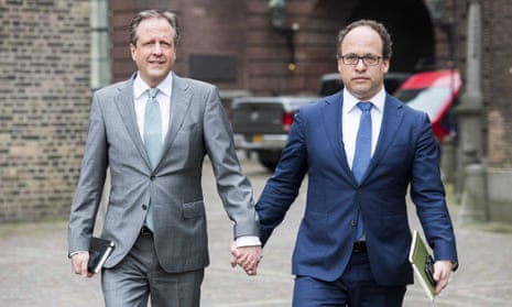 Alexander Pechtold (L), leader of the Democrats D66 party, and Wouter Koolmees, financial specialist of D66, hold hands as they arrive for a talk between relevant political parties, The People's Party for Freedom and Democracy (VVD), Christian Democratic Appeal (CDA), Democrats 66 (D66) and the Green Left Party (GroenLinks), in The Hague, The Netherlands, 03 April 2017. They participate in a solidarity action for two gay men who were physical abused after holding hands in public in Arnhem, on 1 April 2017.  EPA/LEX VAN LIESHOUT