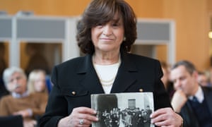 Angela Orosz holds a photo of her parents' wedding