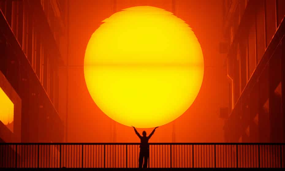 Olafur Eliasson’s artifical sun blazes in the Turbine Hall of Tate Modern, 2003.