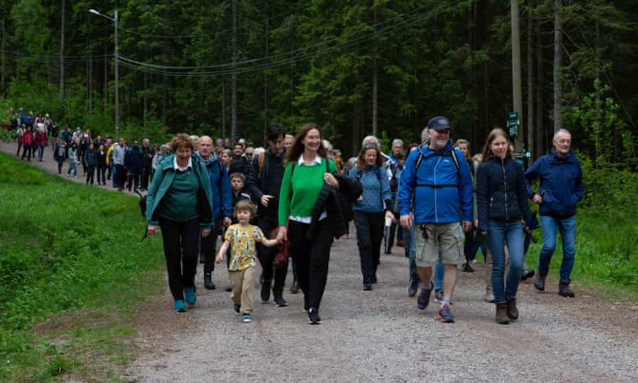 People walk into a forest near Oslo on 12 June to celebrate the eighth year of the Future Library project.