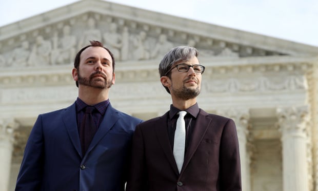 Charlie Craig, left, and David Mullins wait to speak to journalists after the US Supreme Court argued the case Masterpiece Cakeshop v Colorado Civil Rights Commission in December in Washington.