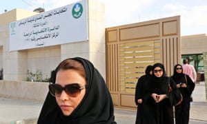 Saudi women leave a polling station in Riyadh after counting their votes.
