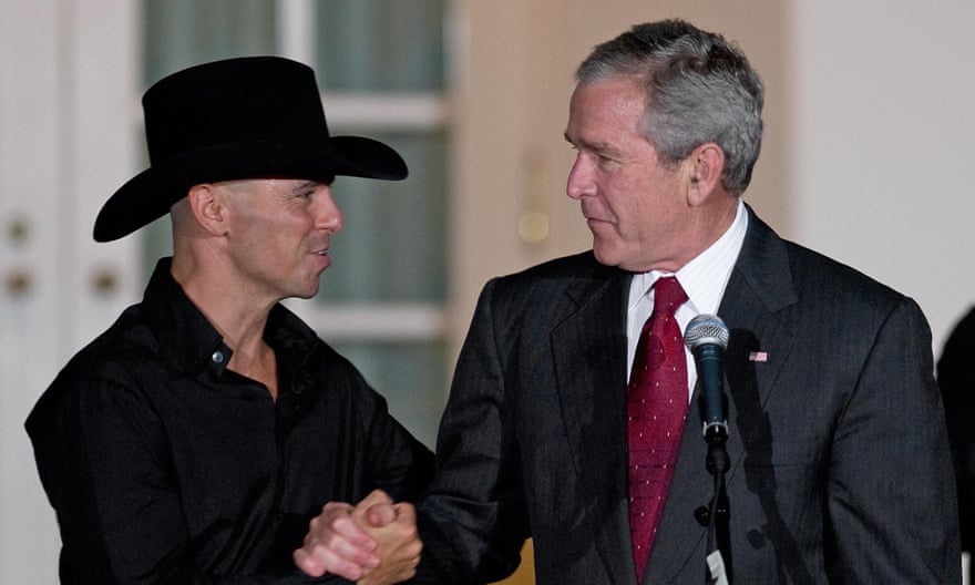 George W Bush shakes hands with country singer Kenny Chesney