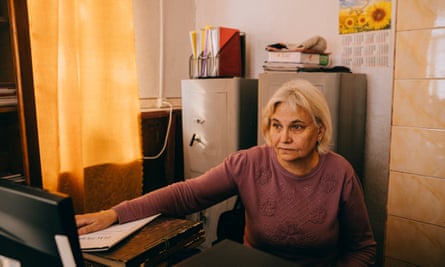Tetiana Slyvenko sits in her office