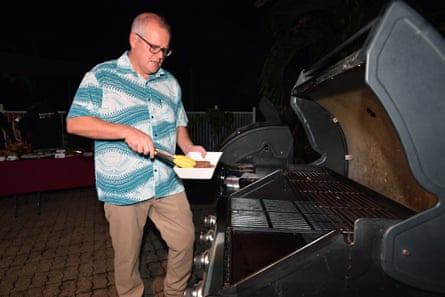 Scott Morrison tends to the barbecue at the home of the Australian high commissioner to the Solomon Islands on Sunday.