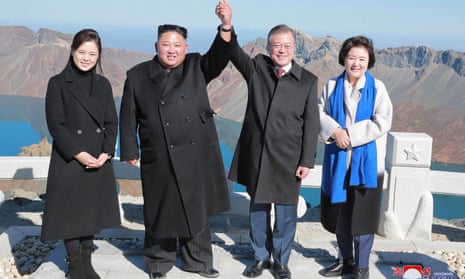 Kim Jong-un and his wife Ri Sol Ju (L) with South Korean president Moon Jae-in (2nd R) and his wife Kim Jung-sook (R) on Mount Paektu, where Kim attempted to make ‘finger hearts’ sign. 