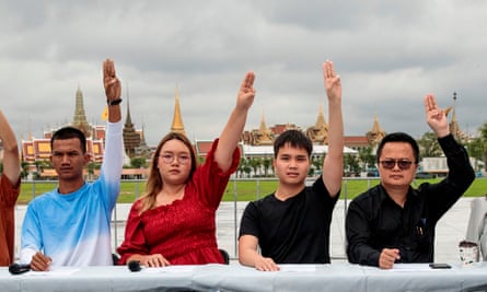 Panusaya Sithijirawattanakul raises a three finger salute during a press conference with other pro-democracy supporters last week prior to a planned protest on Wednesday