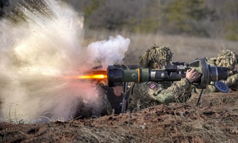 A Ukrainian serviceman fires an anti-tank weapon during an exercise.