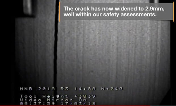 Screen shot from video footage of a vertical crack in piece of graphite with quote - 'The crack has now widened to 2.9mm, well within our safety assessments.