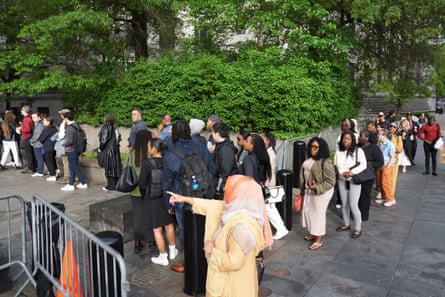 people stand in line outside