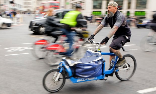 Cyclist on cargo bike in London