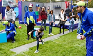 Cricket supporters prepare for Sunday’s match between India and Pakistan in the fan zone in Manchester.