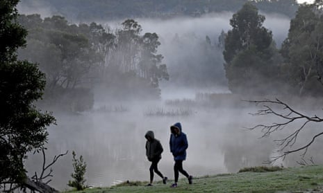 Two walkers brave the cold weather at Birdsland reserve east of Melbourne