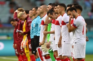 The players line up before the match.