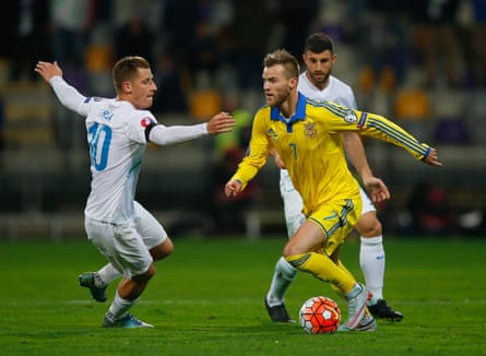 Andriy Yarmolenko of Ukraine goes past Valter Birsa of Slovenia during the Euro 2016 qualifier play-off second leg match.