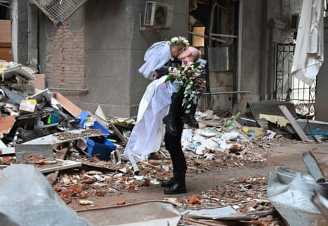 Newlyweds celebrate among the ruins of Kharkiv, Ukraine)