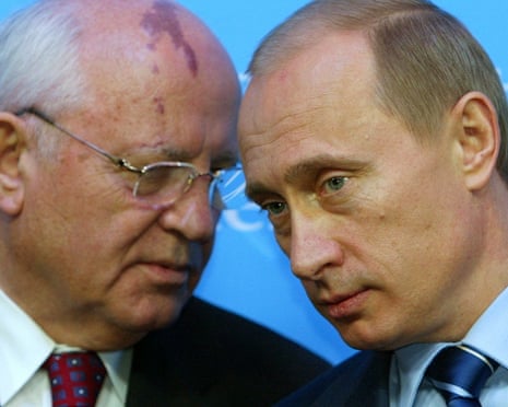 Vladimir Putin (right), with Mikhail Gorbachev (left) at a news conference