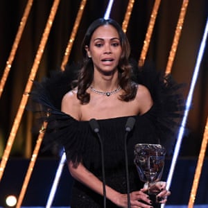 Zoe Saldaña accepts the supporting actress award for Emilia Pérez