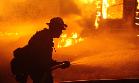 Firefighters try to extinguish the Dixie fire in Greenville, California, on Thursday.
