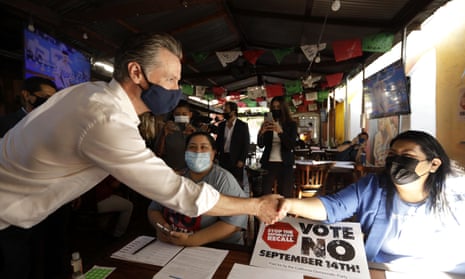 Gavin Newsom greets volunteers who were working the phone banks in support of voting against the governor’s recall at Hecho en Mexico restaurant in East Los Angeles.