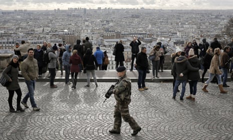 A soldier patrols outside the Sacre Coeur basilica in Montmartre, Paris