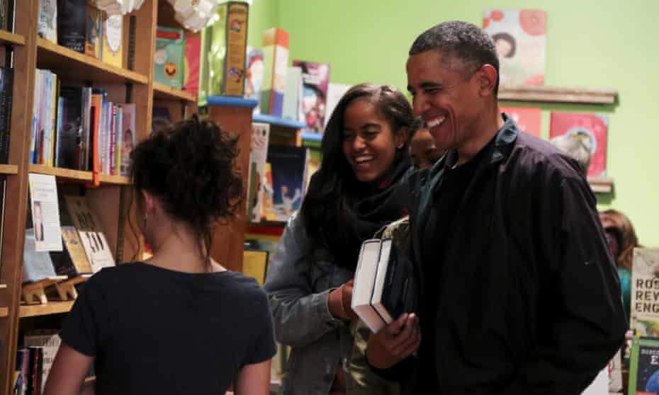 Barack Obama buys books for his daughters Malia and Sasha at Upshur Books Store in Washington.