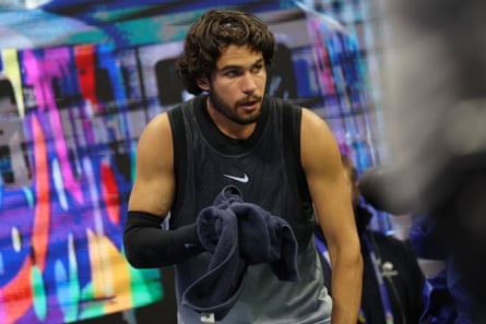Carlos Alcaraz, of Spain, looks on after vomiting into a towel after the fourth set against Ben Shelton at the US Open. Carlos Alcaraz, of Spain, looks on after vomiting into a towel after the fourth set against Ben Shelton at the US Open.