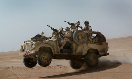 A Land Rover Defender in the northern Kuwaiti desert in 2003.
