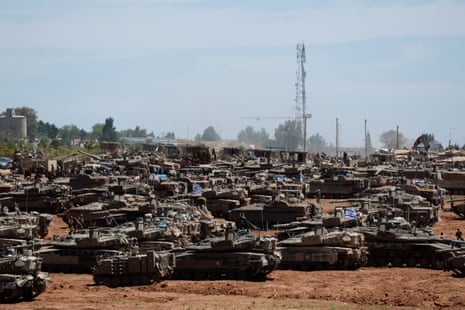 Israeli military vehicles are seen near the Israel-Gaza border on Wednesday.