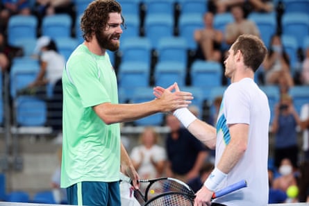 Andy Murray shakes hands with the 6ft 11in Reilly Opelka after their semi-final