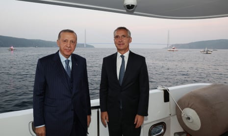 Recep Tayyip Erdogan and Jens Stoltenberg  stand side by side during their meeting in Istanbul on Friday