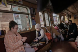Natalia Shaposhnik, 36, plays with her daughter Veronika, 7, in a stationary subway car in a metro station in northern Kharkiv.