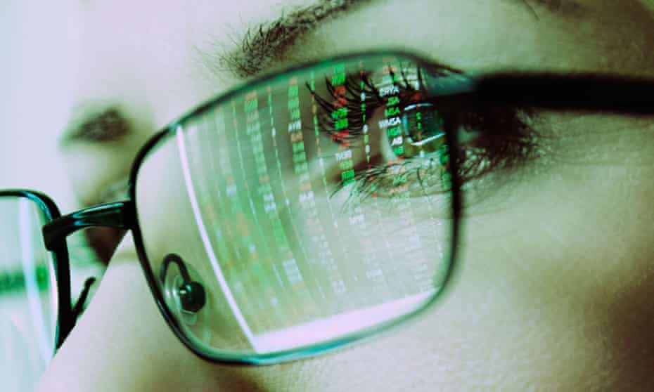 Females Face with Spectacles Reflecting a Computer Screen Display of Stock Market PricesBB4BX9 Females Face with Spectacles Reflecting a Computer Screen Display of Stock Market Prices