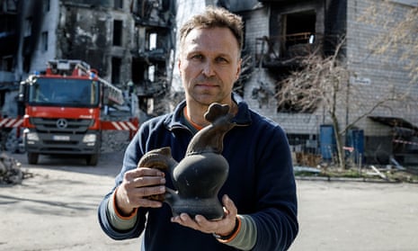 The curator of the Maidan Museum, Ihor Poshyvailo, with the ceramic cockerel that has become a symbol of Ukrainian resistance