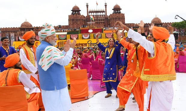 Narendra Modi (centre) greets participants after addressing the nation from the ramparts of the Red Fort in New Delhi