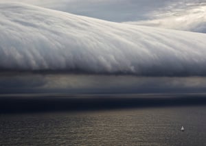  A competitor in the 66th Sydney to Hobart yacht race heads towards a storm cloud. This year’s ocean race has been hit by thunderstorms and hail, but only one boat has withdrawn. 