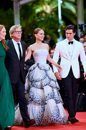 Julianne Moore, Natalie Portman and Charles Melton looked on as Todd Hayne's May December received a six-minute standing ovation during its premiere. 

Haynes and Melton went for contrasting black and white suiting while Moore wore an emerald green gown from Louis Vuitton and Portman chose another sparkly option from Dior, this time inspired by the Junon dress from the house's 1949 collection.