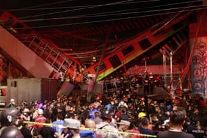 Mexican television and social media showed train cars hanging in mid-air as sirens blared nearby