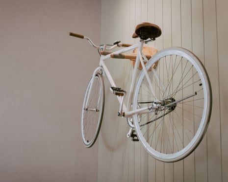 Classic white bike Hung on a white wood wall