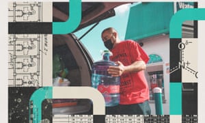 man carries water jug