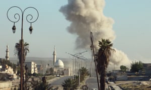 Smoke rises after an airstrike in a rebel-held area of Aleppo