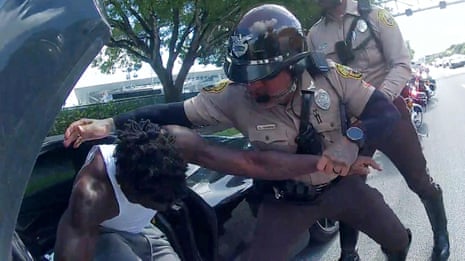 Tyreek Hill: footage shows police dragging NFL star from car – video