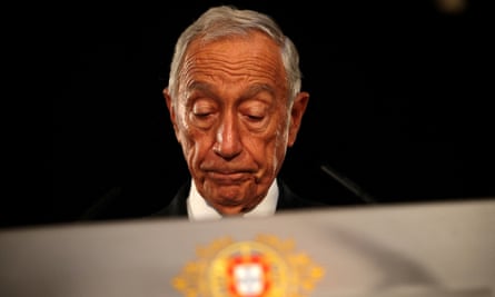 Headshot of Marcelo Rebelo de Sousa looking down with his eyes closed