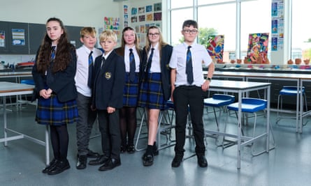 Six children in school uniform in classroom