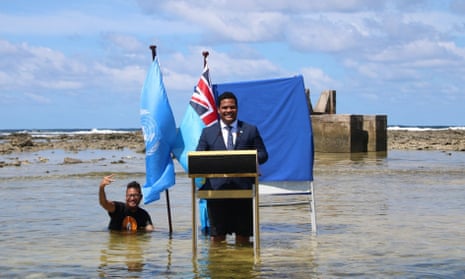 'We are sinking': Tuvalu's foreign affairs minister Simon Kofe standing knee-deep in the ocean in Funafuti, Tuvalu