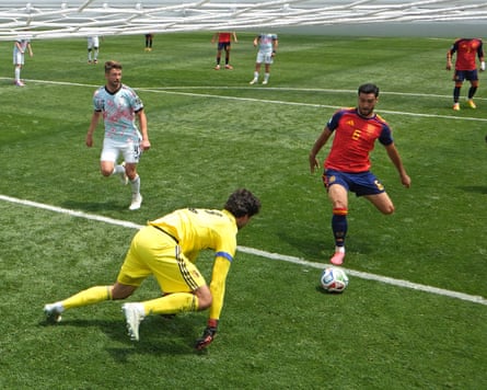 Mikel Merino scores Spain’s winner after Belgium keeper Senne Lammens spilled the ball.