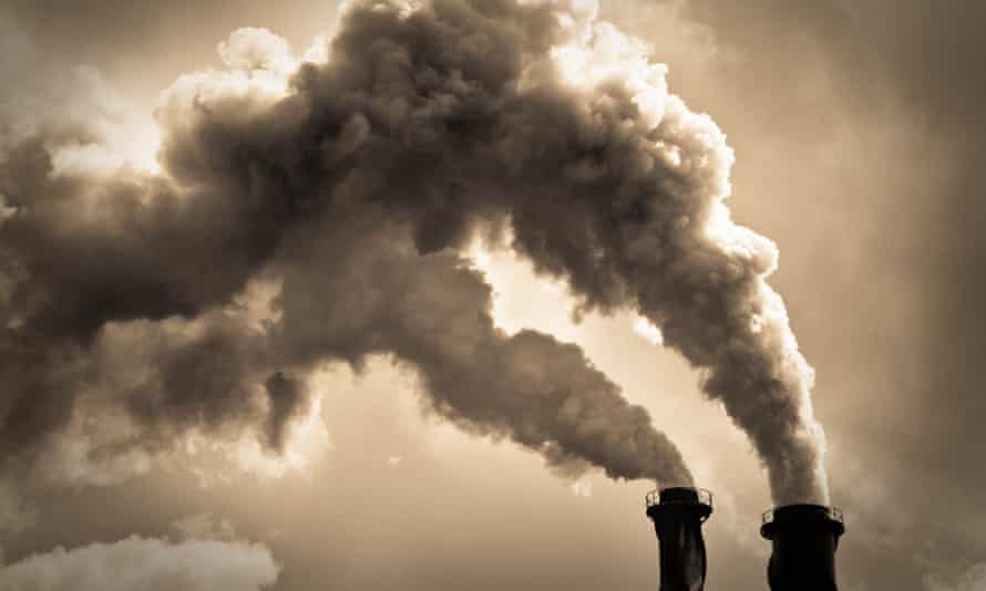 Industrial Air PollutionToned monchrome image with billowing smoke coming from two chimneys. Please note that limited film grain has been added during image processing.