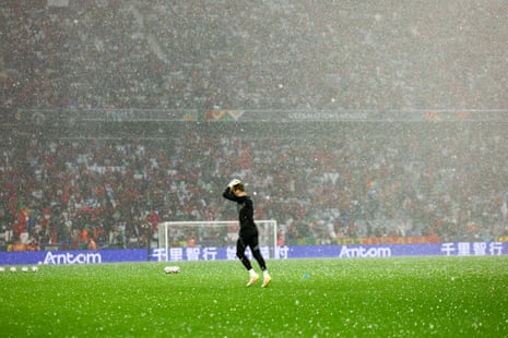 Hail and rain fall on the pitch ahead the Nations League semi-final between Germany and Portugal.